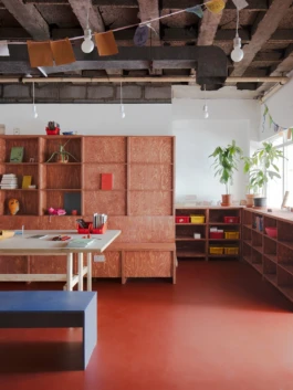red stained timber joinery item in a youth centre