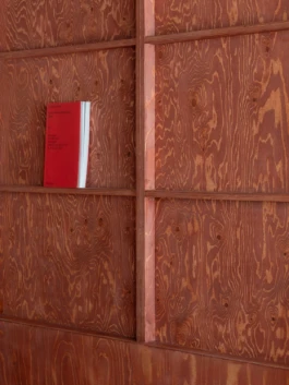 close up of red stained timber joinery item